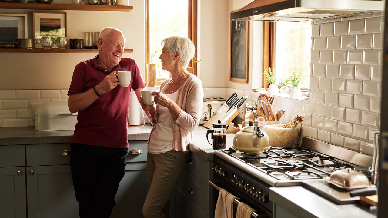 Retired couple drinking coffee together